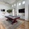 a living room with a table and chairs