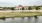 a building with a pond in front of it