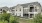 a large house with a fence in front of it