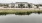 a body of water with a building in the background
