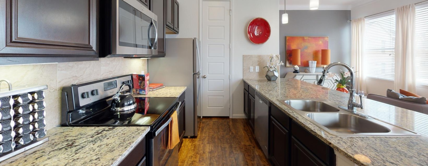 a kitchen with black appliances