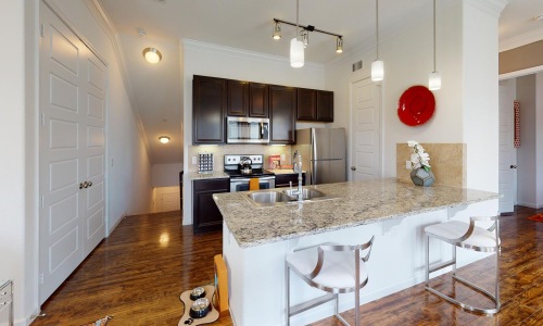 a kitchen with a marble island