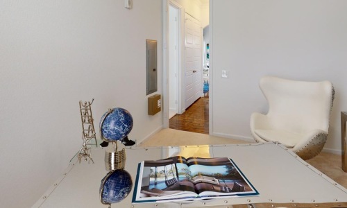 a room with a table and chairs